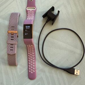 Fitbit Purple Smartwatch with Charger and Extra Band